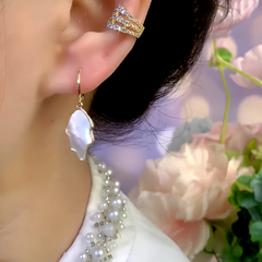 Model showcasing the dangle and style of the 14K Gold-Plated Zircon Enamel Leaf Tassel Earrings