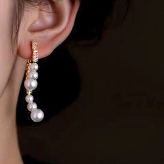 Close-up detail of the sparkling zircons and plating on the Sculpting Pearl Arc