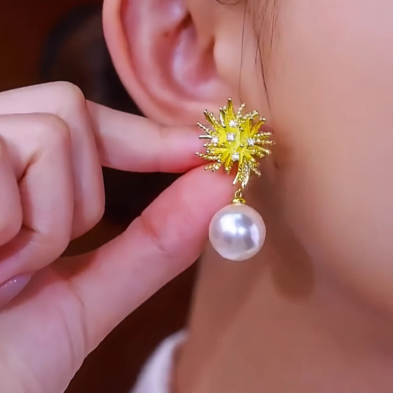 Close-up detail of the sparkling zircons and plating on the Firework Pearl Earrings