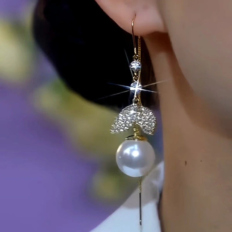 Close-up detail of the sparkling zircons and plating on the Fishtail Threader Earrings