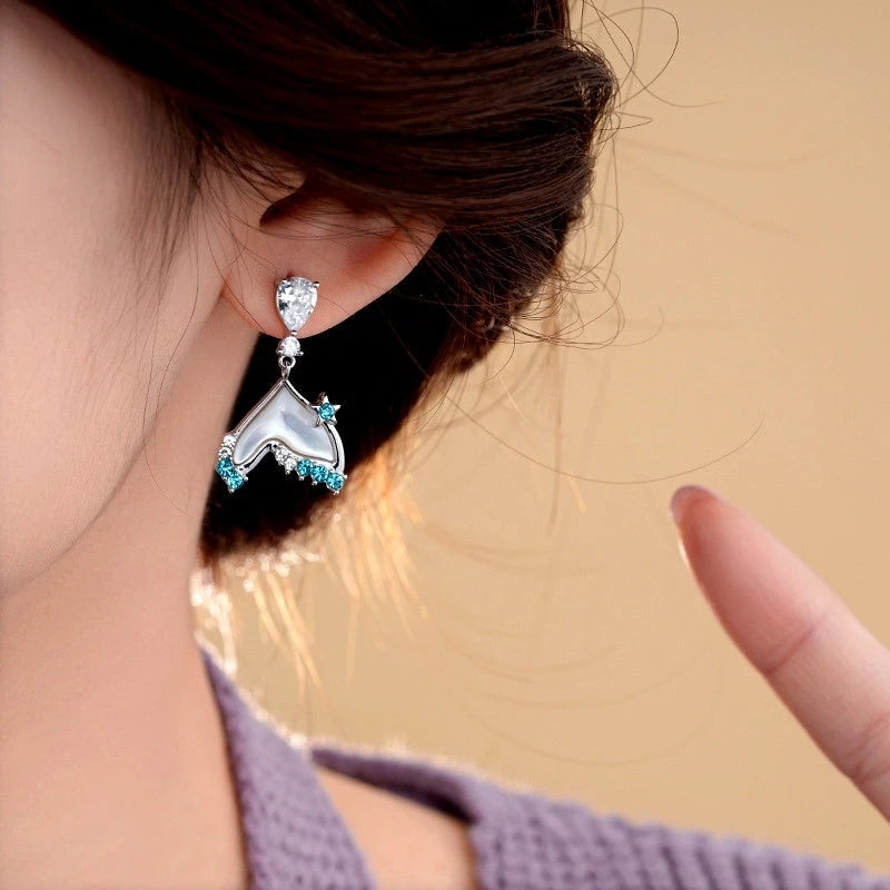 Close-up detail of the sparkling zircons and plating on the Fishtail Tassel Earrings