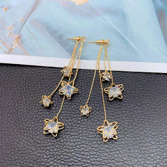 Angled view of the 14K Gold-Plated Zircon Five-Pointed Star Tassel Earrings