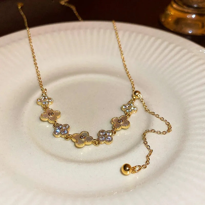 Detailed view of the 14K Gold-Plated Zircon Flour Leaf Adjustable Necklaces chain and pendant