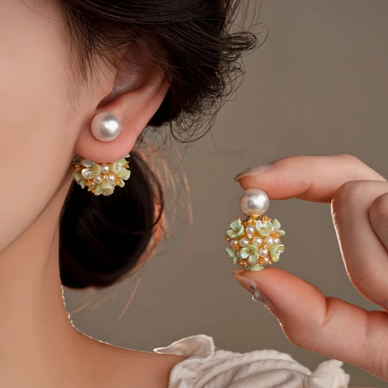 Close-up detail of the sparkling zircons and plating on the Pink Flower Ear Jackets