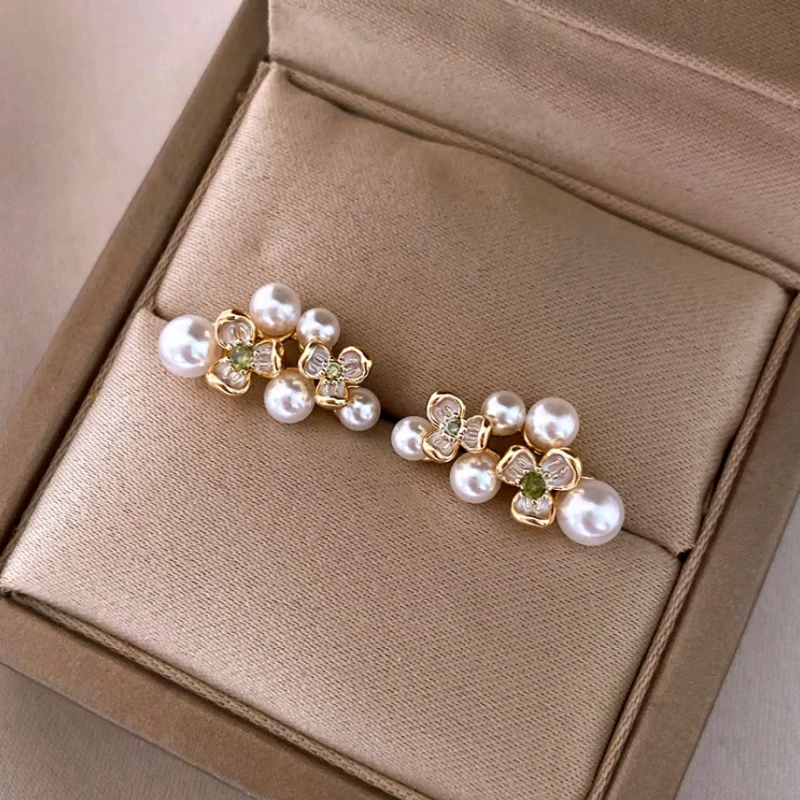 Angled view of the 14K Gold-Plated Zircon Flower Bead Stud Earrings