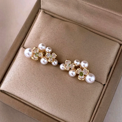 Angled view of the 14K Gold-Plated Zircon Flower Bead Stud Earrings