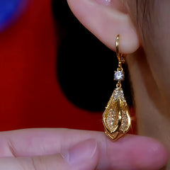 Close-up detail of the sparkling zircons and plating on the Mesh Flower Bud