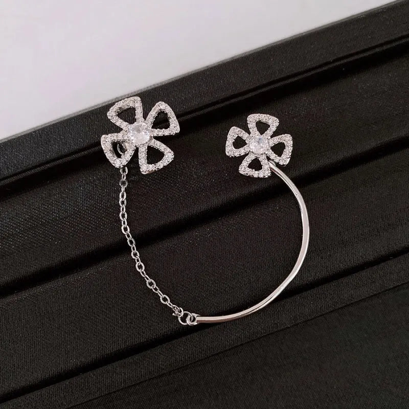 Model showcasing the dangle and style of the 14K Gold-Plated Zircon Flower Ear Cuff ( 1 PCS )
