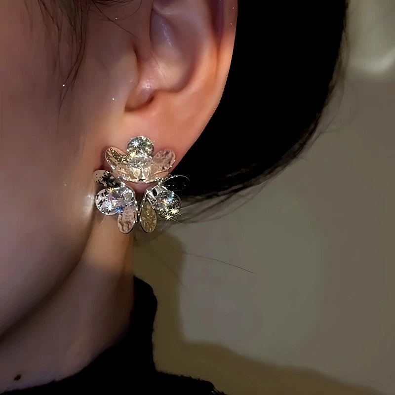 Close-up detail of the sparkling zircons and plating on the Floral Halo Studs