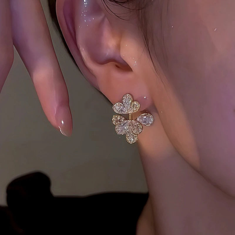 Close-up detail of the sparkling zircons and plating on the Hollow Flower Earrings