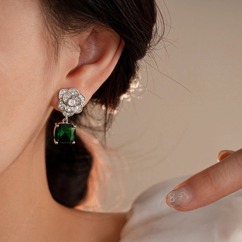 Close-up detail of the sparkling zircons and plating on the Green Petal Earrings