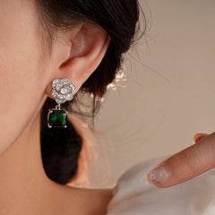 Close-up detail of the sparkling zircons and plating on the Green Petal Earrings