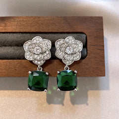 Angled view of the 14K Gold-Plated Zircon Flower Green Diamond Earrings