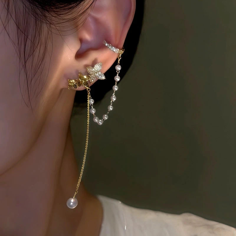 Close-up detail of the sparkling zircons and plating on the Floral Pearl Ear Cuffs