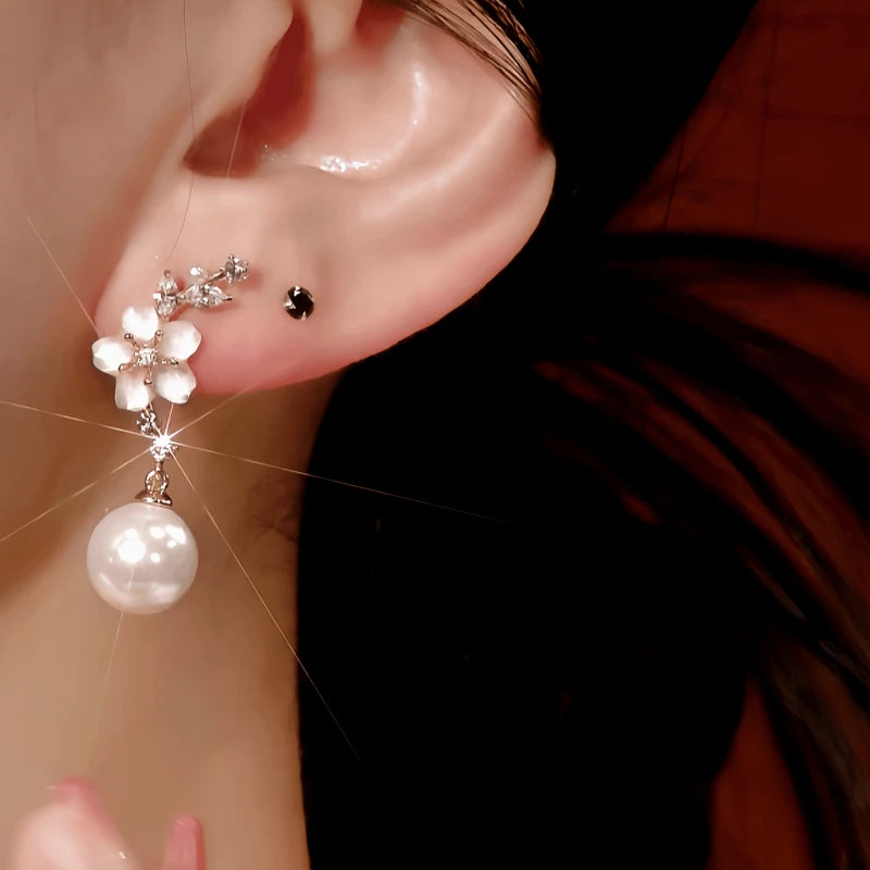 Close-up detail of the sparkling zircons and plating on the Pink Camellia Pearl