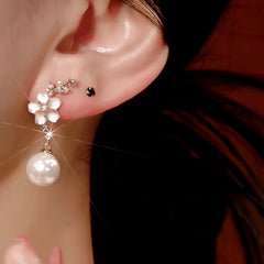 Close-up detail of the sparkling zircons and plating on the Pink Camellia Pearl