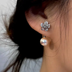 Close-up detail of the sparkling zircons and plating on the Pearl Flower Ear Jackets
