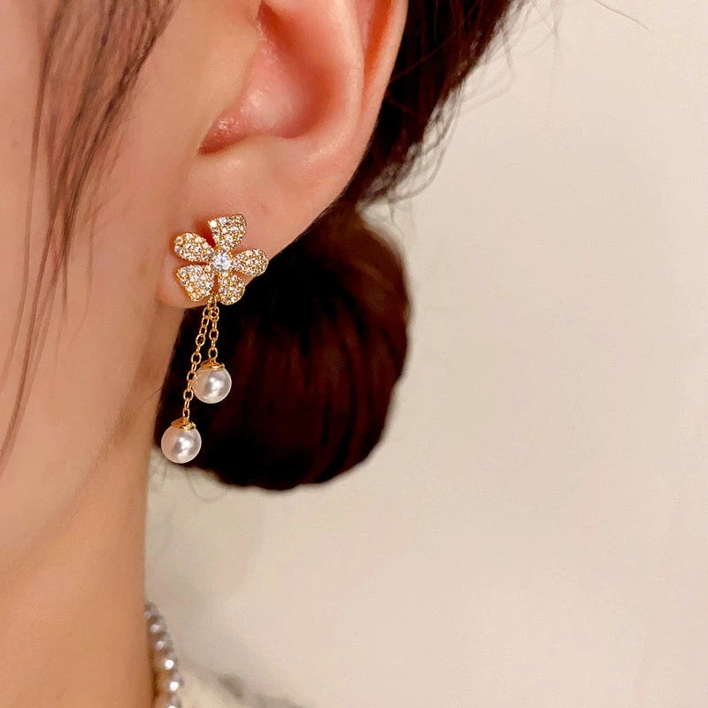 Close-up detail of the sparkling zircons and plating on the Floral Pearl Tassel