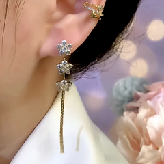 Model showcasing the dangle and style of the 14K Gold-Plated Zircon Flower Tassel Earrings