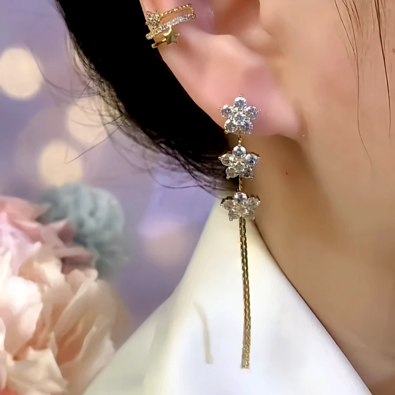 Close-up detail of the sparkling zircons and plating on the Camellia Tassel Earrings