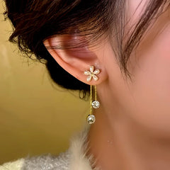 Close-up detail of the sparkling zircons and plating on the Golden Flower Tassel