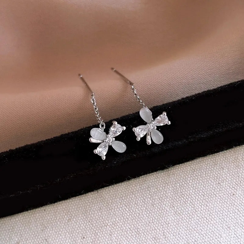 Close-up detail of the sparkling zircons and plating on the Floral Threader Earrings