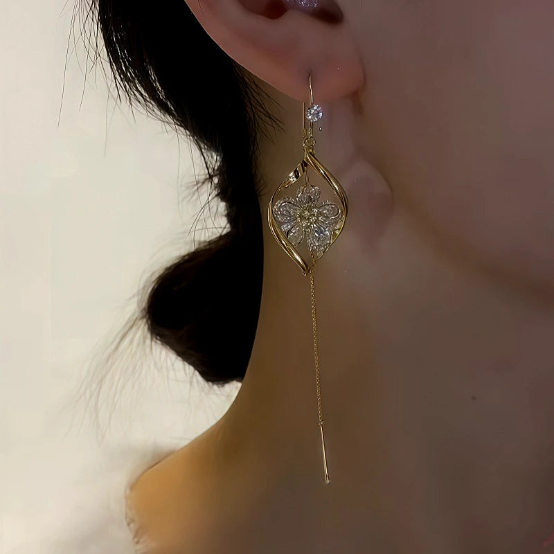 Angled view of the 14K Gold-Plated Zircon Flower Threader Earrings