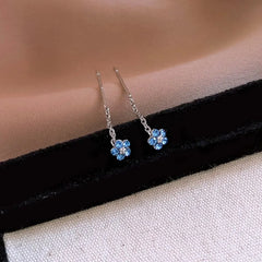 Angled view of the 14K Gold-Plated Zircon Flower Threader Earrings