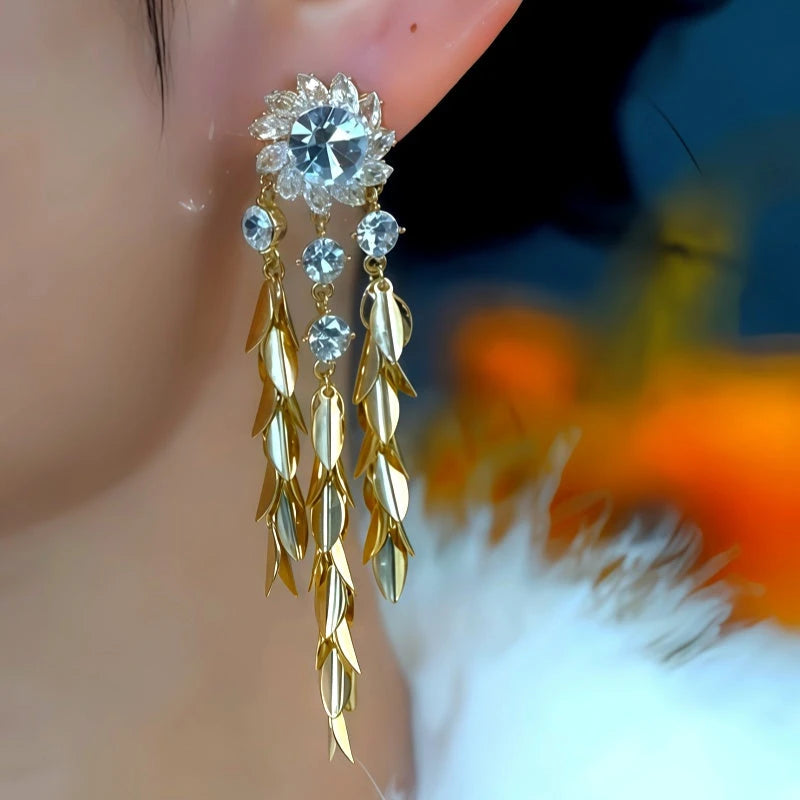 Model showcasing the dangle and style of the 14K Gold-Plated Zircon Flower Wheat Tassel Earrings