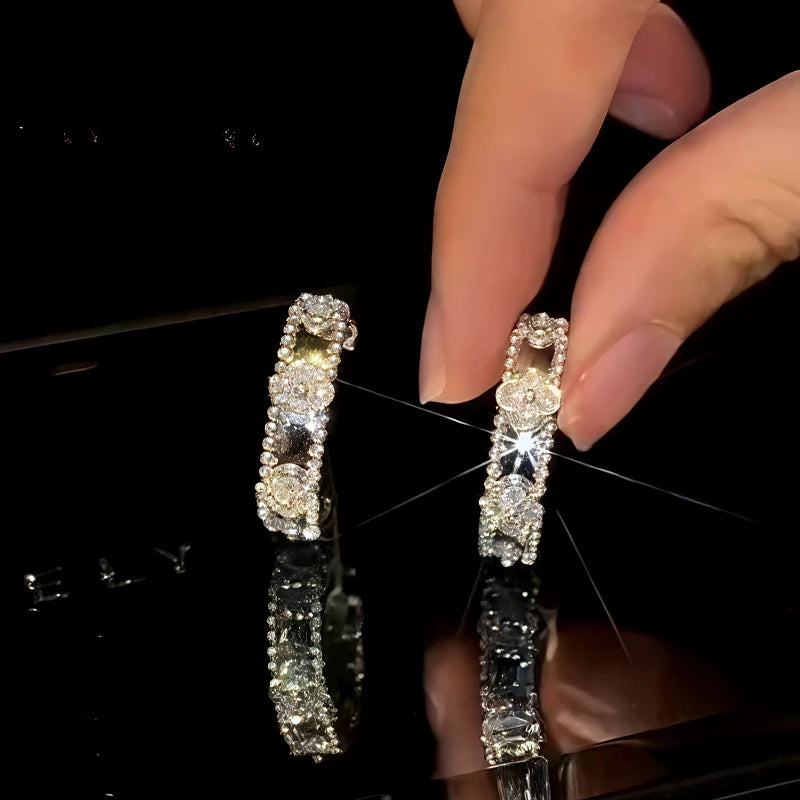 Angled view of the 14K Gold-Plated Zircon Four-Leaf Clover C-Shaped Earrings
