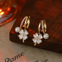 Angled view of the 14K Gold-Plated Zircon Four-Leaf Flower Pearl Earrings
