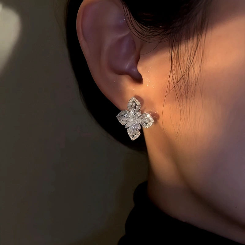 Close-up detail of the sparkling zircons and plating on the Silver Clover Studs