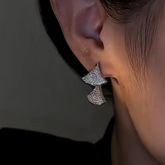 Model showcasing the dangle and style of the 14K Gold-Plated Zircon Front And Back Earrings
