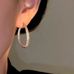 Model showcasing the dangle and style of the 14K Gold-Plated Zircon Front And Back Hanging Earrings