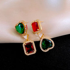 Model showcasing the dangle and style of the 14K Gold-Plated Zircon Geometric Square Heart Earrings
