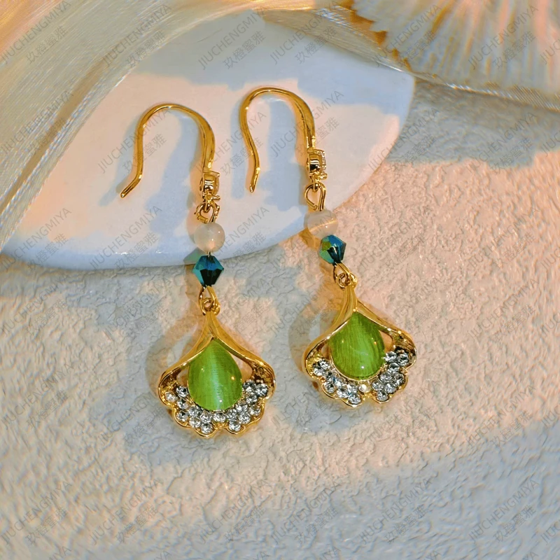 Angled view of the 14K Gold-Plated Zircon Ginkgo Leaf Ear Hooks