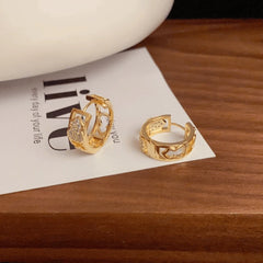 Angled view of the 14K Gold-Plated Zircon Gourd Hoop Earrings