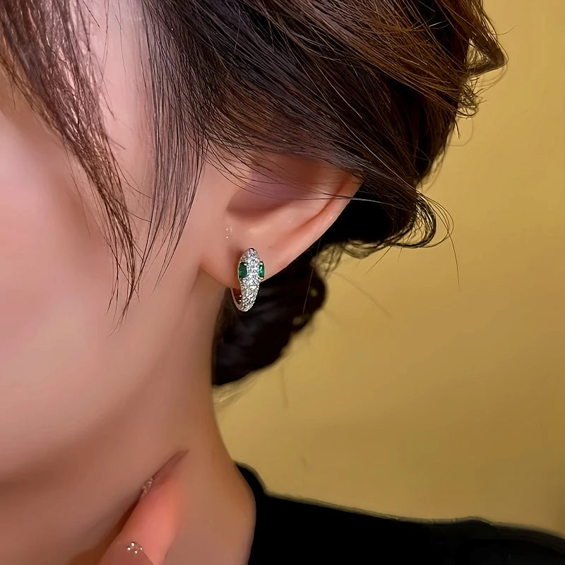 Close-up detail of the sparkling zircons and plating on the Silver Snake Hoops