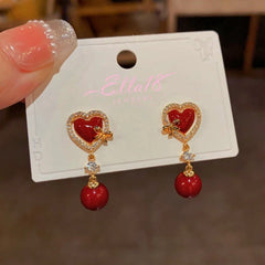 Close-up detail of the sparkling zircons and plating on the Red Heart Pearl Studs