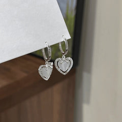Angled view of the 14K Gold-Plated Zircon Heart Bow Earrings