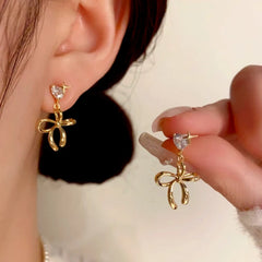 Close-up detail of the sparkling zircons and plating on the Heart Bow Tassel