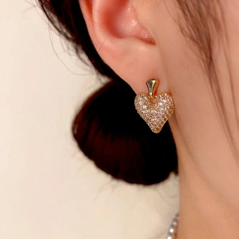 Close-up detail of the sparkling zircons and plating on the Dainty Heart Charm