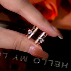 Angled view of the 14K Gold-Plated Zircon Heart Hoop Earrings