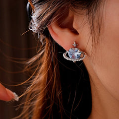 Angled view of the 14K Gold-Plated Zircon Heart Star Pearl Earrings