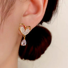Close-up detail of the sparkling zircons and plating on the Heart Tassel Drops