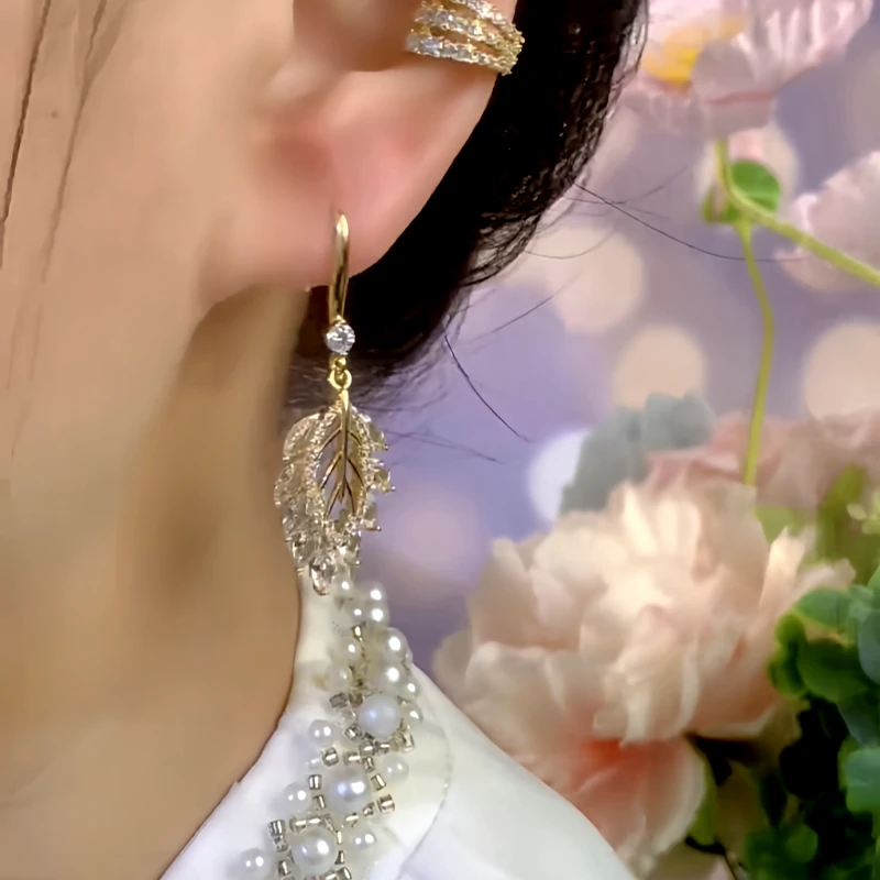 Close-up detail of the sparkling zircons and plating on the Hollow Leaf Ear Hooks