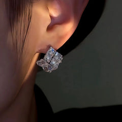 Model showcasing the dangle and style of the 14K Gold-Plated Zircon Hollow Square Earrings