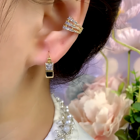 Model showcasing the dangle and style of the 14K Gold-Plated Zircon Hoop Earrings