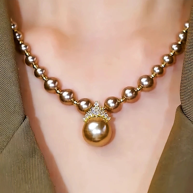 14K Gold-Plated Zircon Inlaid Champagne Pearl Necklace worn to showcase its length and pendant detail