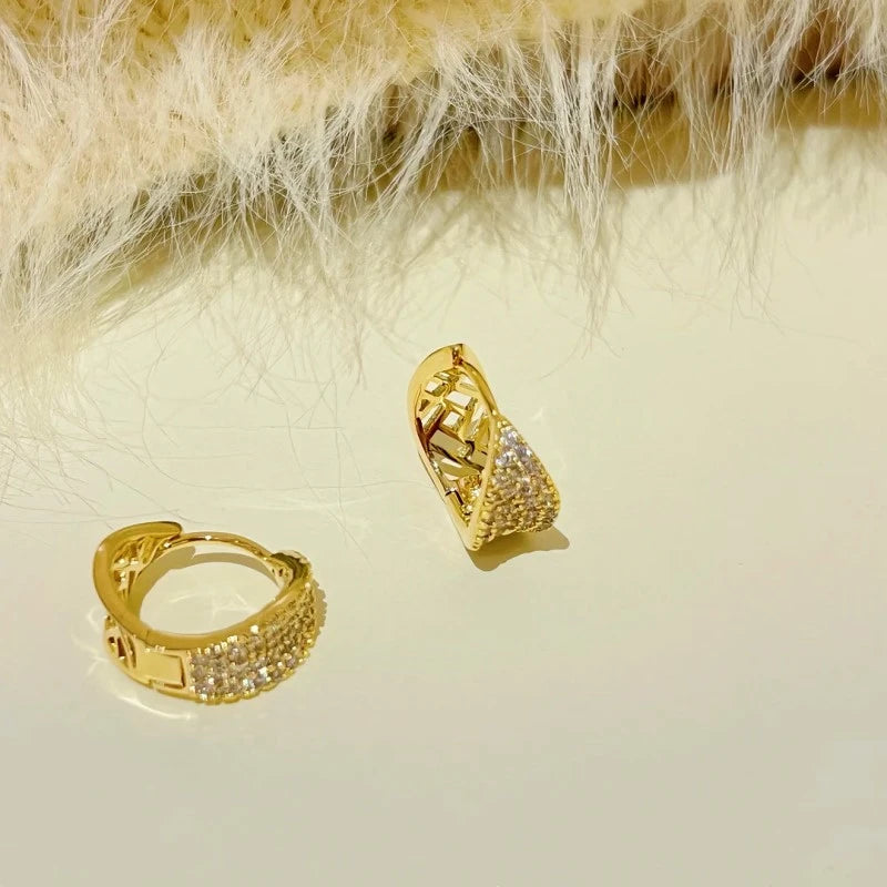 Angled view of the 14K Gold-Plated Zircon Inlaid Leaf Earrings